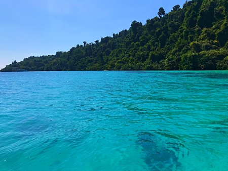 Island coast line and the green clear sea near snorkeling area of Koh Chang, Thailandの写真素材