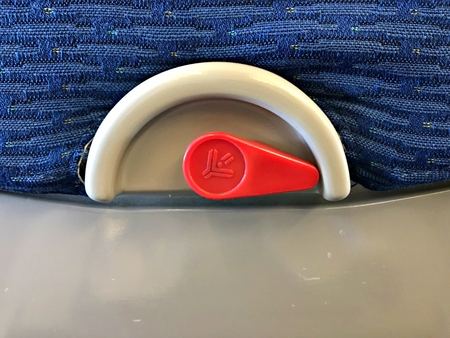 Opened airplane seat tray locker. The standard option for comercial flightの写真素材