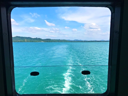 Looking backward from the ferry ship to the Trat Province main land, Thailandの写真素材