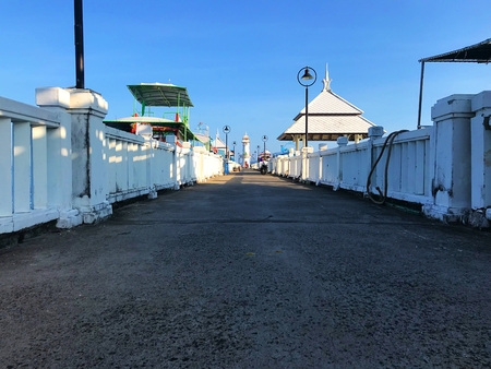 A walk way to light house and clock tower at snorkeling ship harbour of Koh Chang, Thailandの写真素材