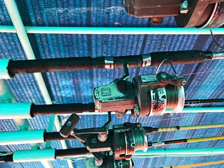 Hanging fishing rod on the roof of the snorkeling ship, Koh Chang, Thailandの写真素材