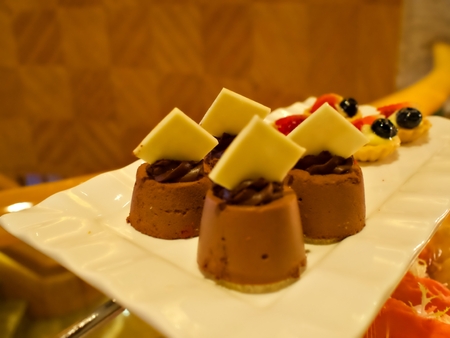 Dessert on the tray, waiting for guest to pick up in the buffet lineの写真素材