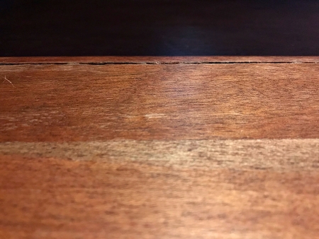 Shadow on the wooden table in the restaurantの写真素材
