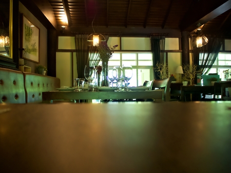 A wooden table and the dining set on the other tableのeditorial素材