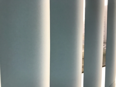 Close up shot on the window shade curtain with a ray of lightの写真素材