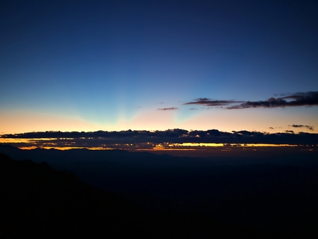 The ray of orange light that emerge from the horizon in the dawn