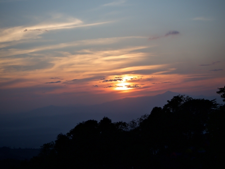 The eveing sunset in the cloud with silhouette tree and mountain, Nan, Thailandの写真素材