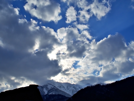 The blue sky with cloud during the sunset and the snow mountain at the horizon in Shirakawago, Japan in Springの写真素材