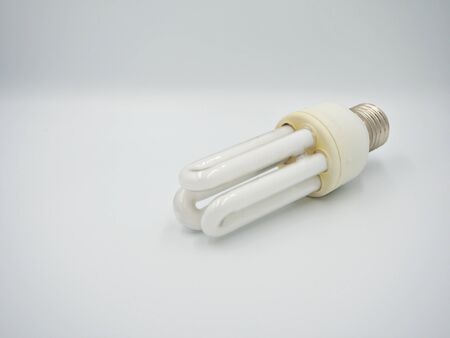 The shot on the used energy saving bulb with white backgroundの写真素材