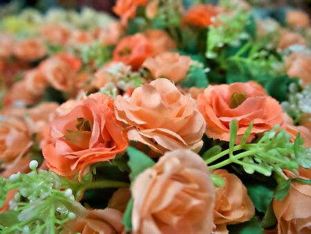 The shot on the colorufl artificial rose in the potの写真素材