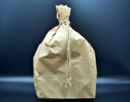 Brwon paper bag with black backgroundの写真素材