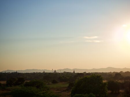 The wide landscape of Bagan under the evening sun