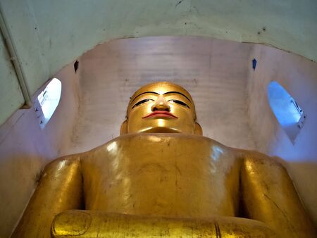 The ancient golden Buddha Statue at the Manuha Temple, Bagan, Myanmarのeditorial素材