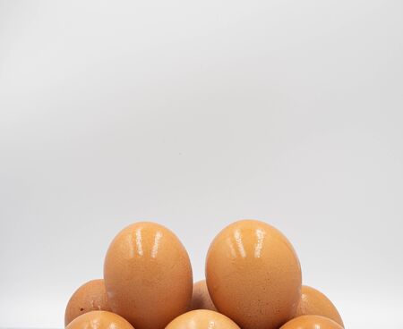 Focus shot on the top of stack of eggs after taking out from fridgeの写真素材