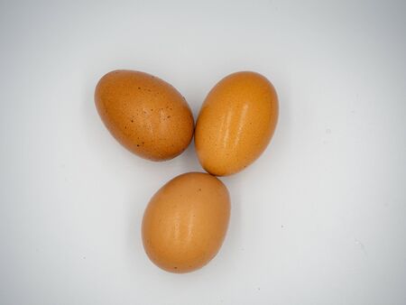 The top shot of three eggs with white backgroundの写真素材