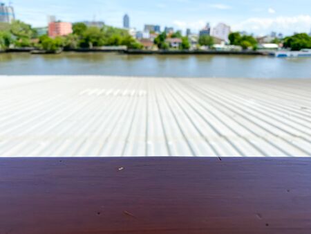 The blur background and the red wooden table for placing objectの写真素材