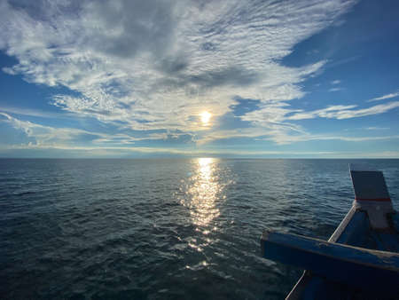 The wave from of the boat to the sea and the sun at horizon at Koh Tao, Thailandの写真素材