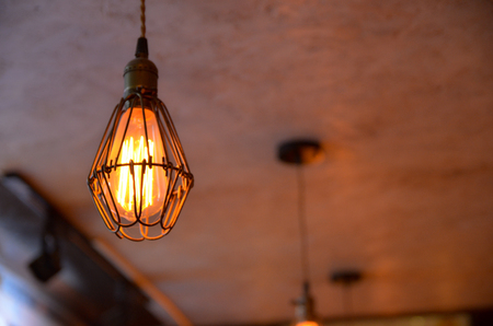A light bulb hanging in the nightclubの写真素材