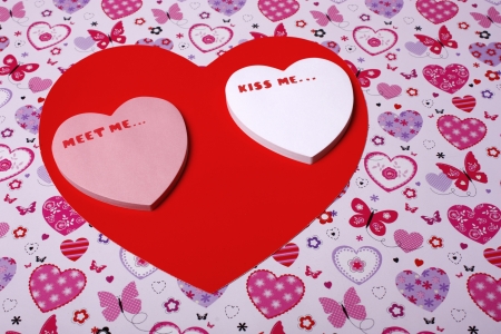 An image showing the concept of valentines day with heart shaped messages with a heart shaped backgroundの写真素材