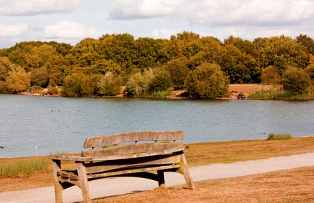 A view of a Park Bench overlooking a lake