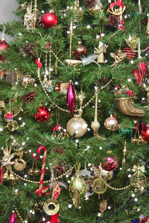 Lights and baubles decorating a christmas treeの写真素材
