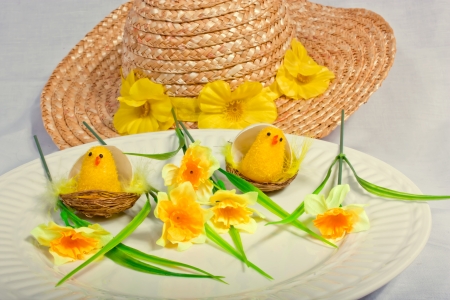 An image showing the concept of easter with a bonnet and daisiesの写真素材