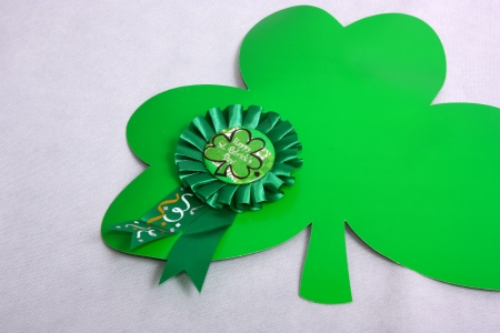 An image showing the concept of St Patricks Day with a hat and clover shapesの写真素材