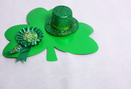 An image showing the concept of St Patricks Day with a hat and clover shapesの写真素材