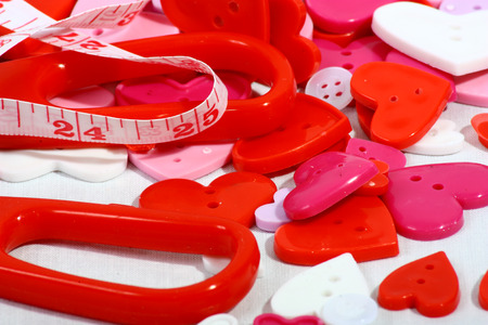 A concept image showing heart shaped buttons and tape measure