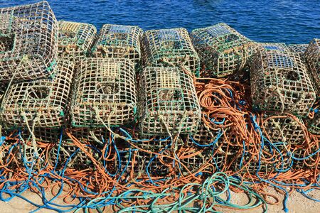 A stack of Lobster traps and colourful ropesの写真素材