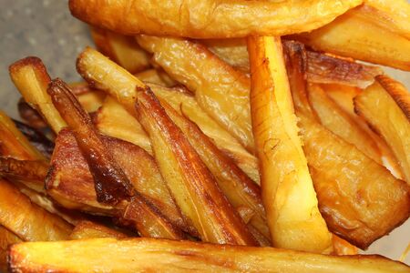 a pile of roasted parsnipの写真素材