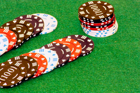 piles of chips laid out on a green backgroundの写真素材