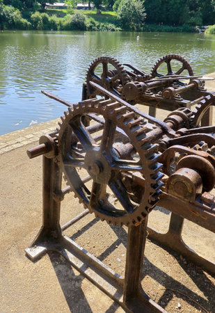 A rusty old machine with cog wheels and levers