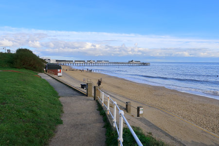 A scenic view of the Pier and sandy beach in Southwold on the Suffolk coastの写真素材