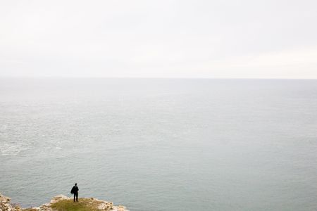 man by the cliff edge の写真素材