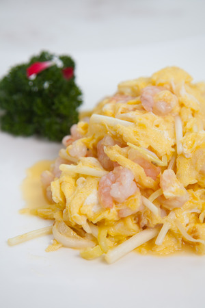 Eggs with shrimps on the plateの写真素材