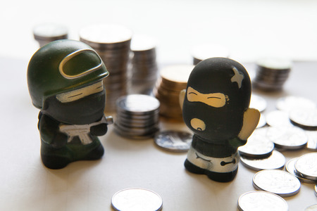 police & robber with coin, protection of financial conceptの写真素材