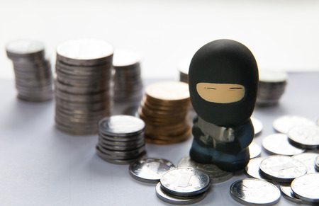 robber with coin, protection of financial conceptの写真素材