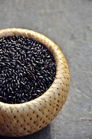 black seeds in the bamboo basketの写真素材
