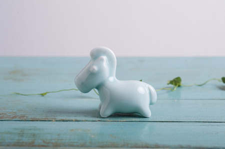 Ceramic horse on the tableの写真素材