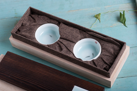 ceramic cups on blue wooden backgroundのeditorial素材