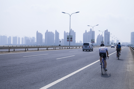 People is riding on the roadの写真素材