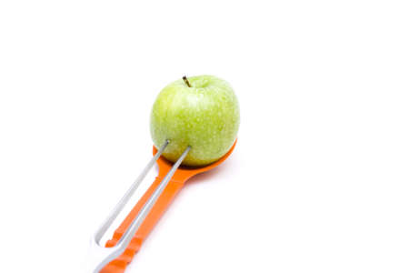 Green Apple  spitted on Meat fork の写真素材