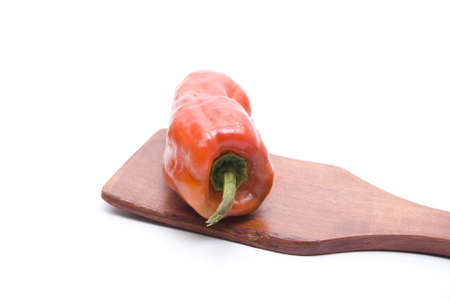 Red Capsicum on Wooden Spoonの写真素材