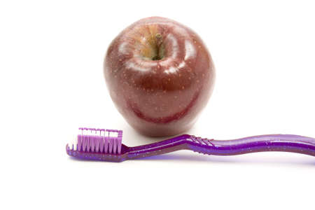 Fresh Red Apple with Toothbrush の写真素材