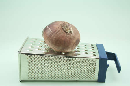Red Onion on Grater の写真素材