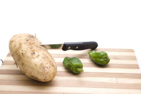 Potatos and Green Capsicum with knife  の写真素材