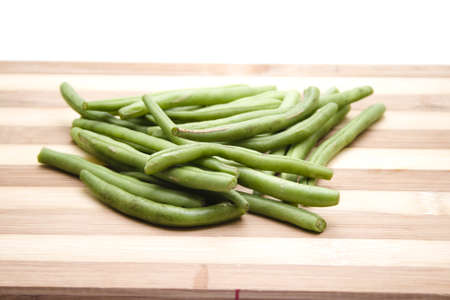 Green String beans on Wooden Plateの写真素材