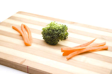 Fresh Broccoli with Carrots on Wooden Plateの写真素材