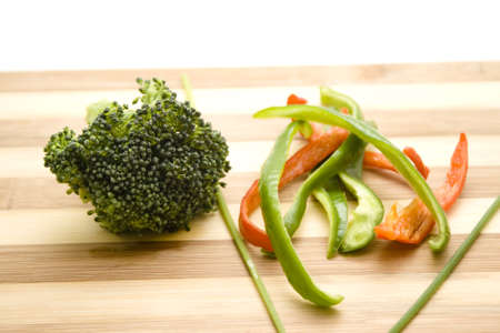 Broccoli with Capsicum  on Wooden Plateの写真素材